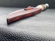 Full English bridle leather with unique welt made from multiple layers of leather to give a unique look. Handmade leather knife sheath which is fully hand stitched and hand finished to ensure the knife within is protected from the elements. We can design to our customer specifications to ensure you get a truly unique and bespoke item. www.leathercompositions.com